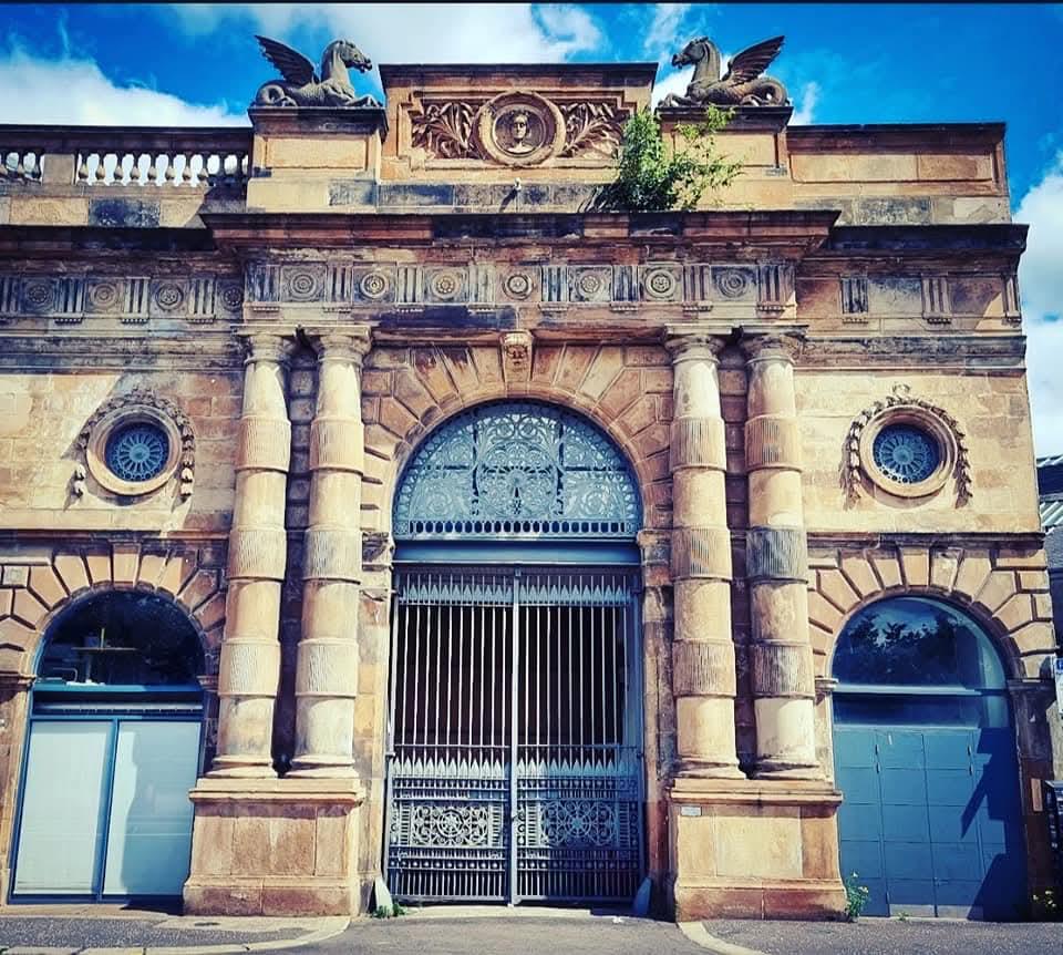 A grand sandstone portico of a Glasgow landmark building